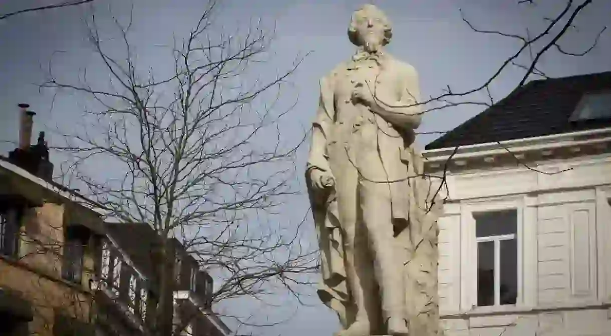 A statue of Flemish writer Theodoor van Rijswijck overlooks a square aptly named Theodoor van Rijswijckplaats