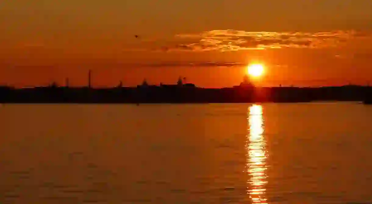 A golden sunset over Helsinki and the Baltic Sea.