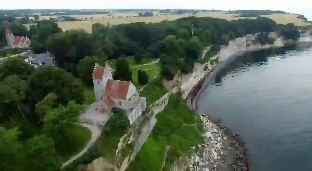 Stevns Klint and the historic Højerup Gamle Kirke from above