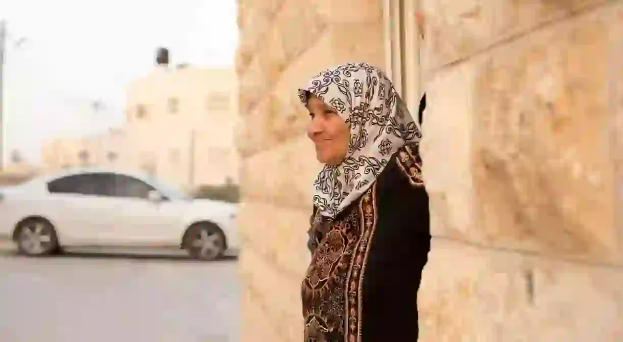 The matriarch of the Abusarah family stands outside her home in al-Azariya, West Bank, May 2018