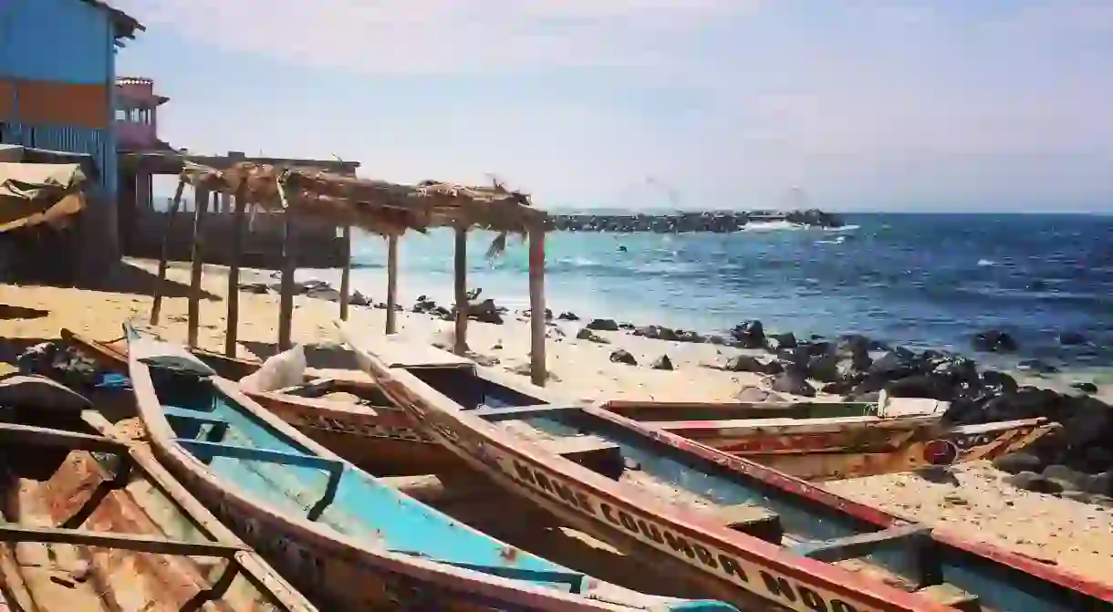 Fishermens pirogues on one of Dakars golden beaches