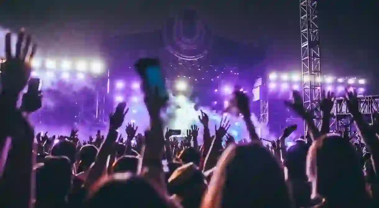 A crowd of festival-goers revel well into the night