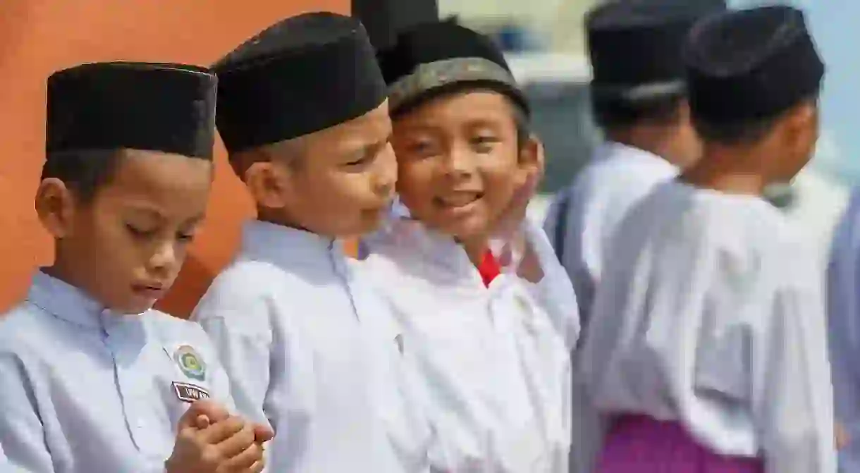 School boys wearing songkok