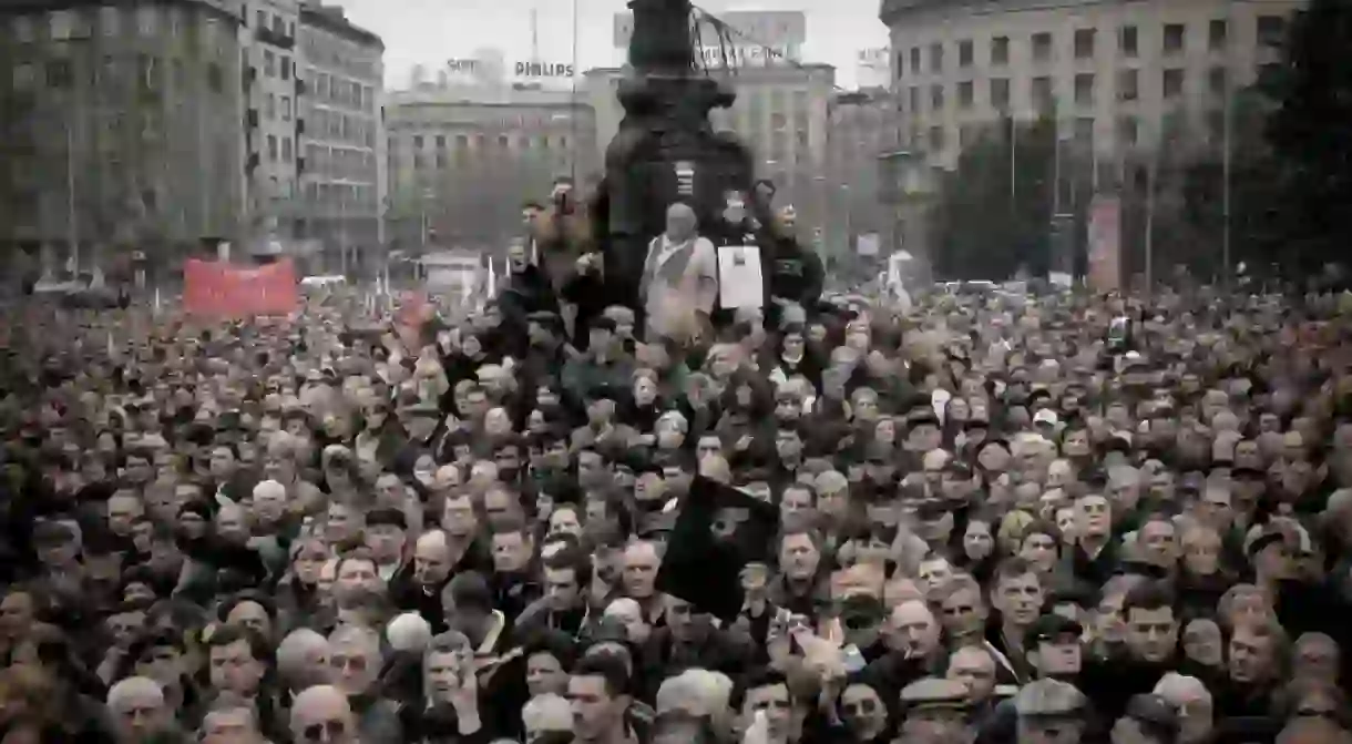 People gather in Belgrade for the funeral procession of Slobodan Milošević