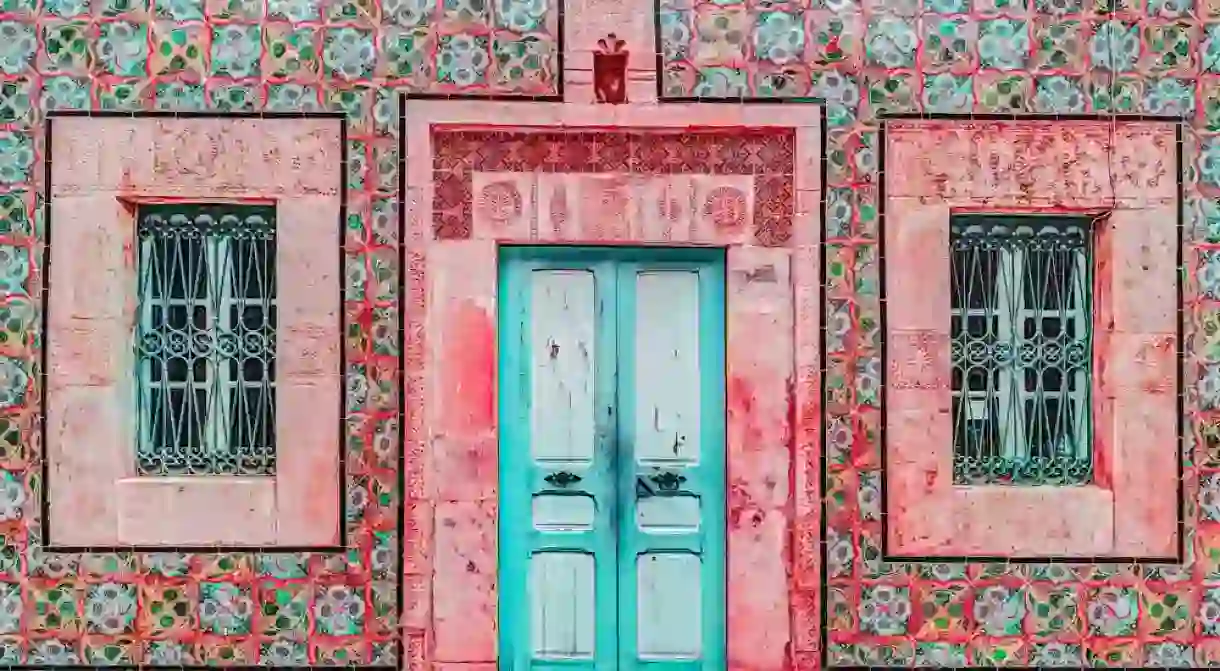 Traditional old painted door in a historical district or medina, Tunisia