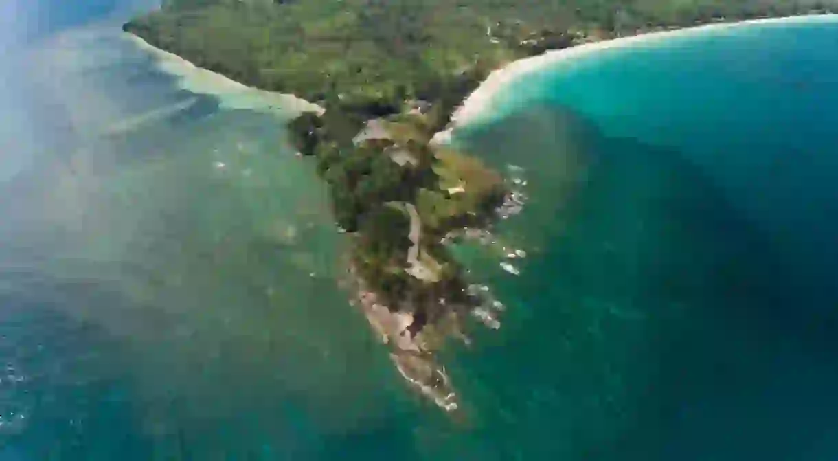 The tip of Borneo as seen from the air, with white sand beaches visible on either side