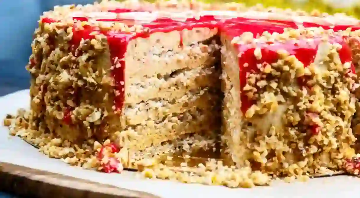 The official cake of Moscow, consisting of multiple layers of walnuts and sponge topped with red glaze