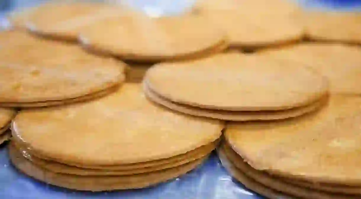 Stacks of fresh, king-sized stroopwafels at Lanskroon