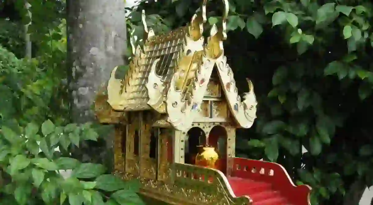 A spirit house in Thailands woods