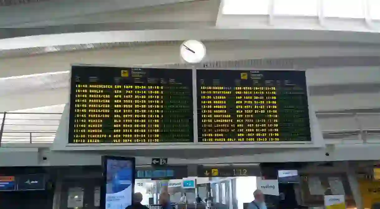 A departures board at Bilbao airport, Spain