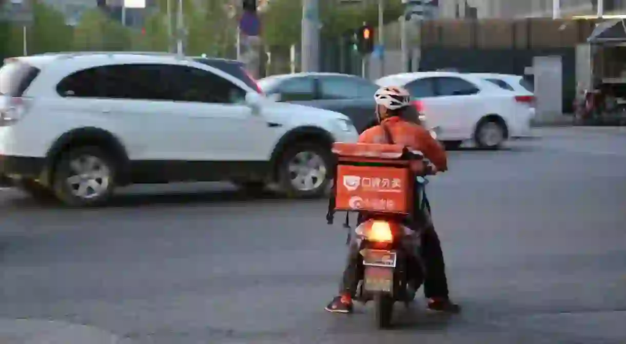 Food delivery bikes often have a big box adorned with logos on the back.