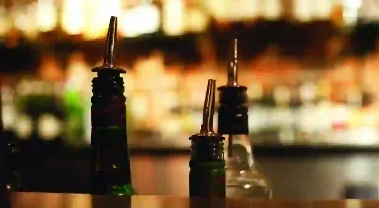 Bottles ready to pour at a cocktail bar