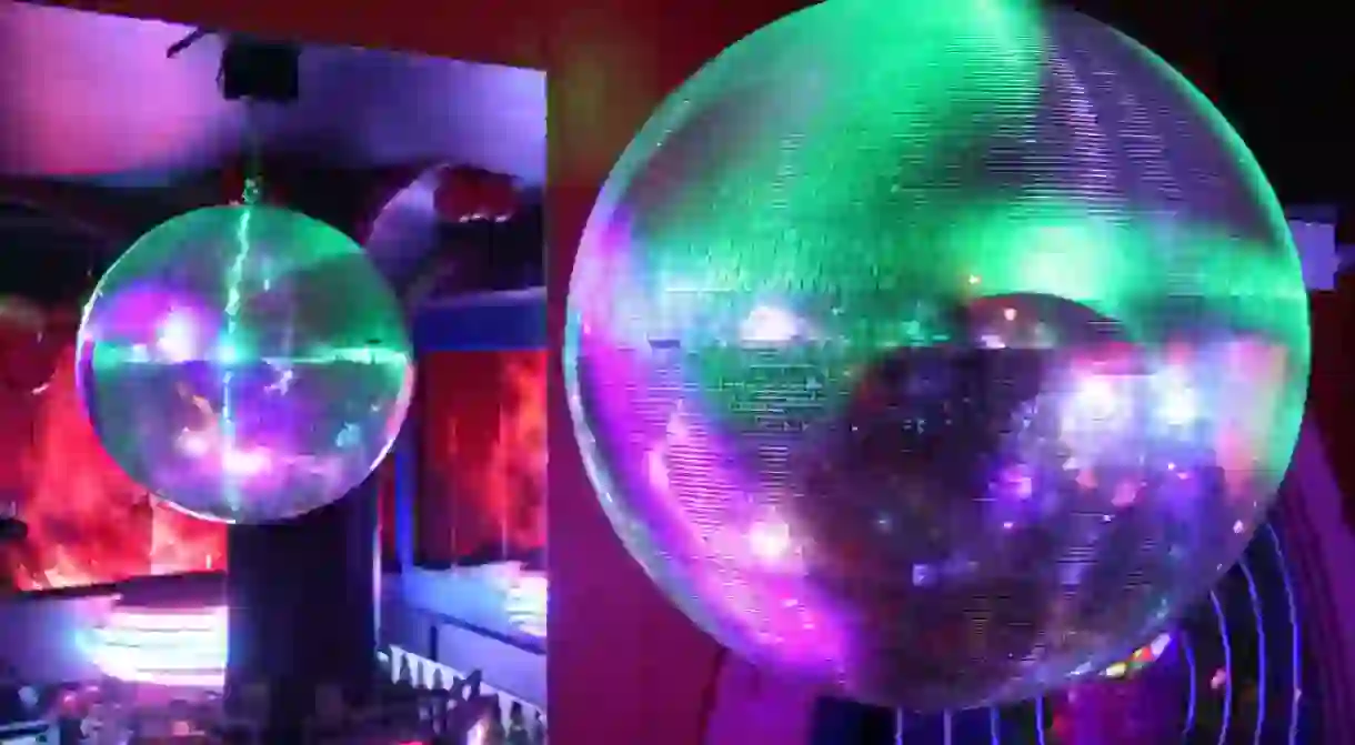 Disco balls glitter invitingly in Busans clubs