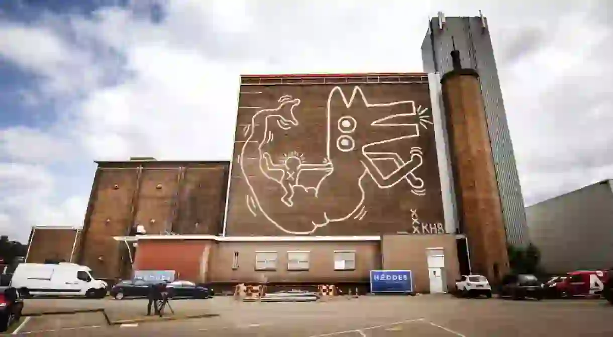 Mandatory Credit: Photo by REMKO DE WAAL/EPA-EFE/REX/Shutterstock (9724796a) A view of the enormous mural painted by the US artist Keith Haring in 1986 on the wall of the former depot of the Stedelijk Museum Amsterdam, in Amsterdam, The Netherlands, 22 June 2018. The mural was then only visible for a few years and disappeared behind aluminum sheets that were removed after almost 30 years. Keith Haring mural made visible in Amsterdam, Netherlands - 22 Jun 2018