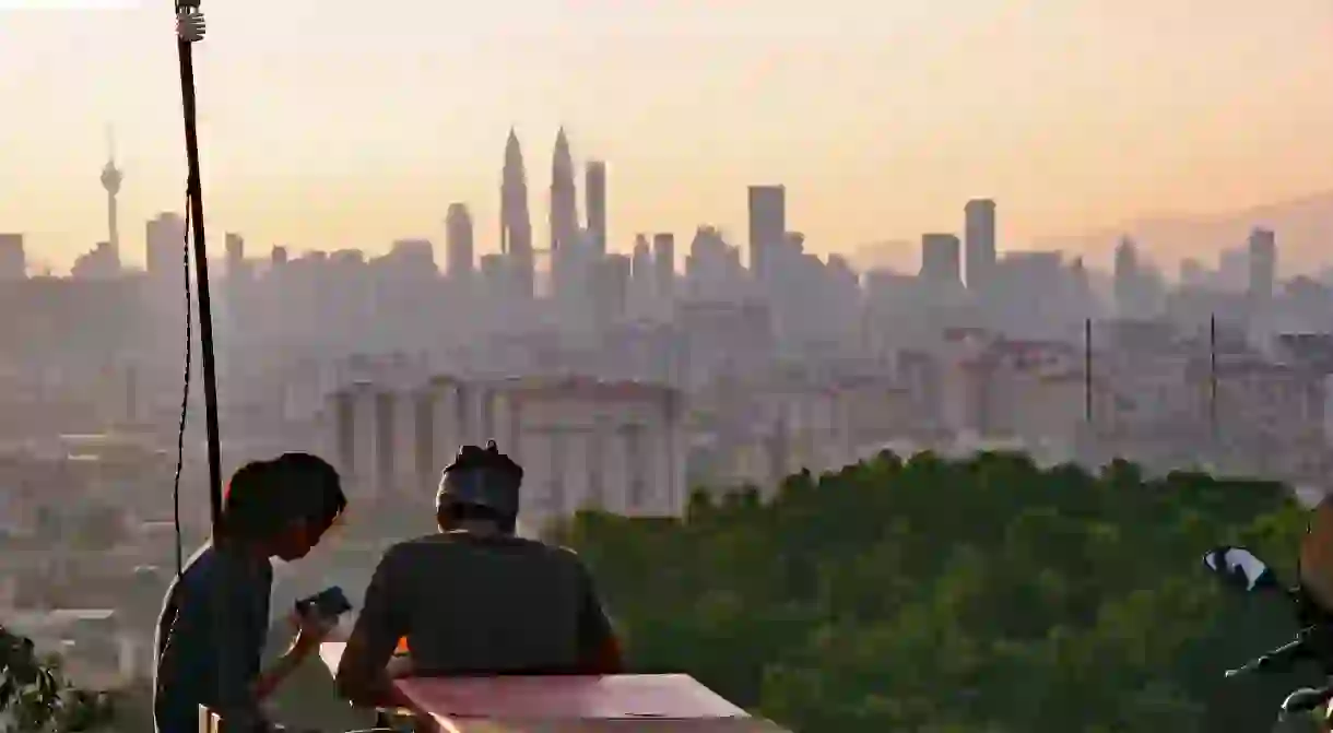 Young couple enjoying the view of Kuala Lumpurs skyline