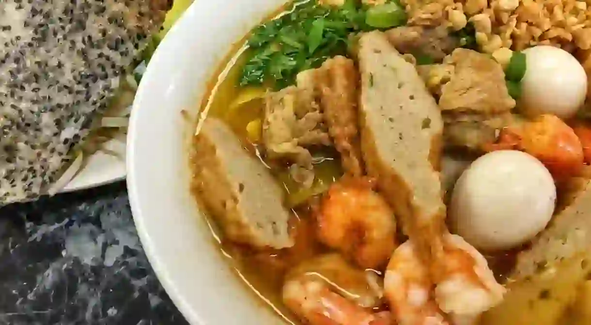 Enjoy some Vietnamese mì quảng noodles.