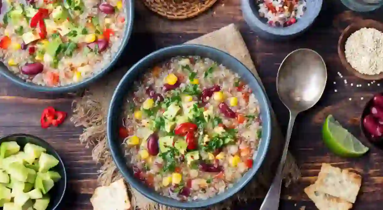 Vegetable quinoa soup, stew with avocado, corn, beans