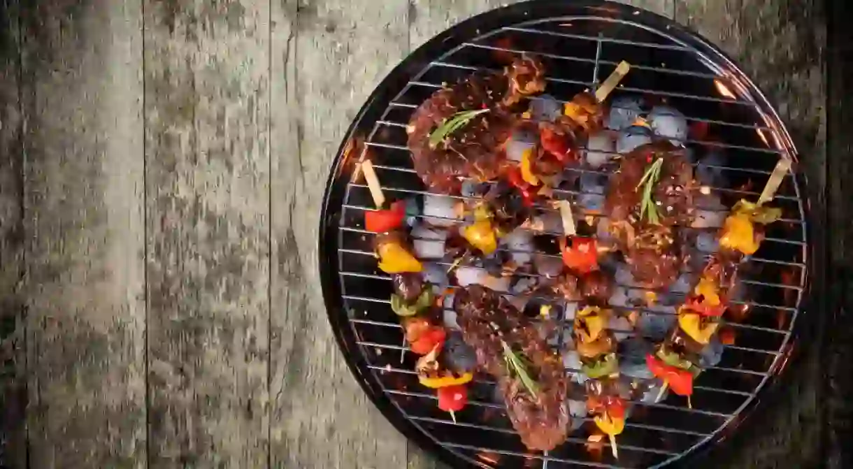 Fresh meat and vegetables cooked over a grill