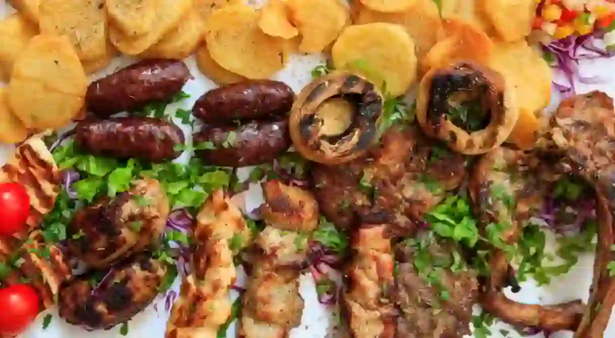 Cypriot mixed grilled meat with vegetables and potatoes