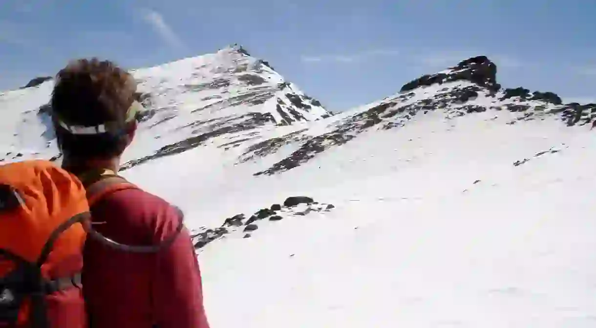 Trekking in a snow covered Sierra Nevada