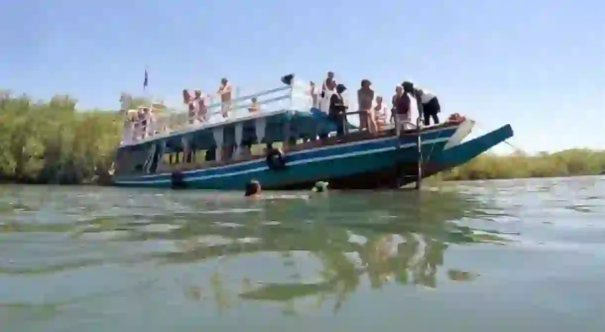 Tourists on an expedition along the River Gambia