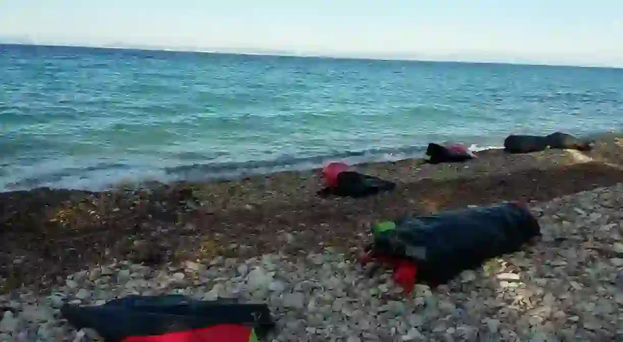 Rubber refugee boats washed up on the shores of Greece