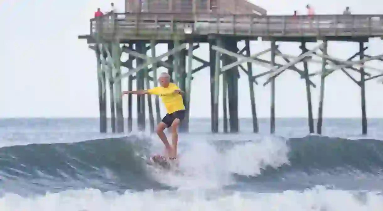 Surfing adjacent to many of the areas piers is common among locals