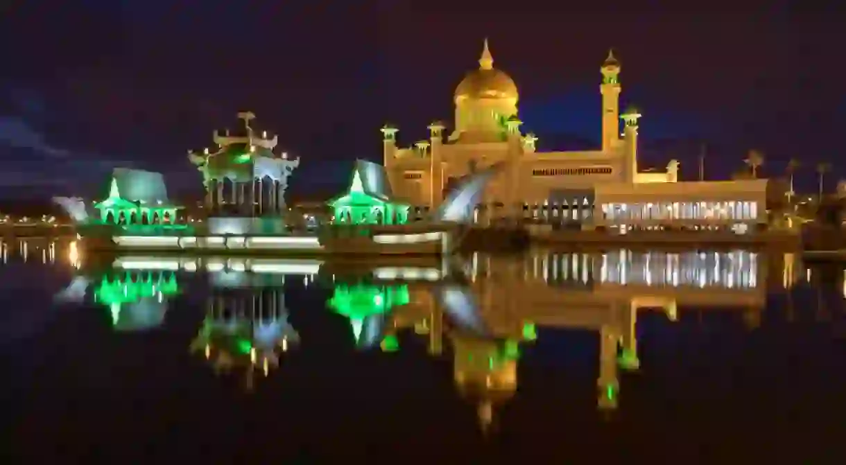 By night, the lights of the Sultan Omar Ali Saiffudien Mosque glisten on the adjacent lagoon