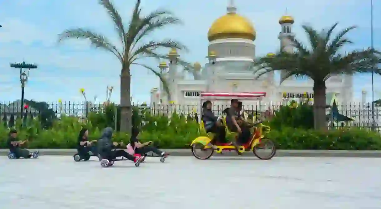 A family cycling in Bandar Seri Begawan