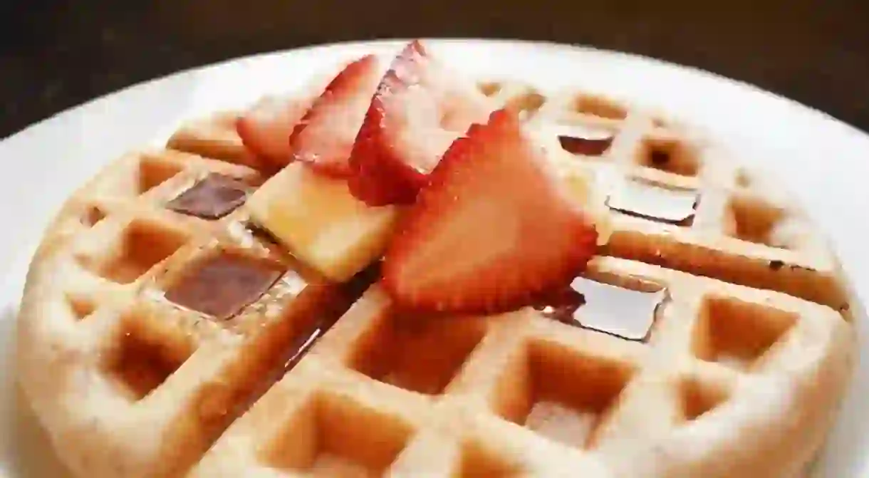 Waffle with chocolate sauce and strawberry