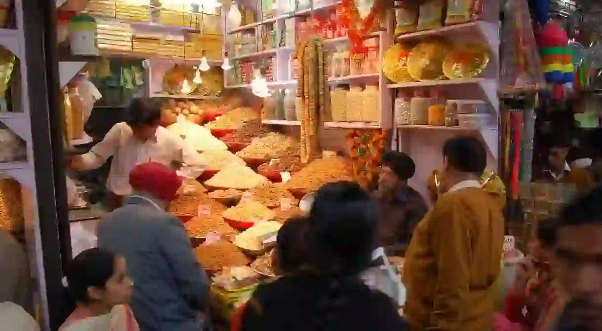 A busy spices and dried fruits shop in Old Delhi