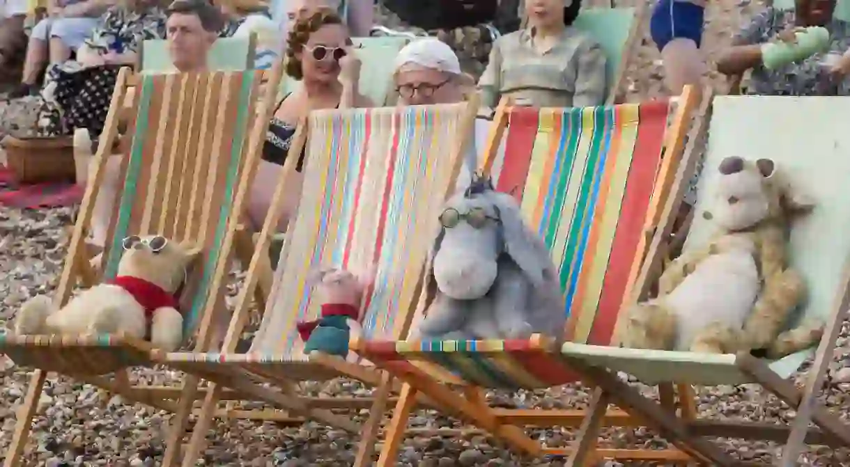 Winnie the Pooh, Piglet, Eeyore and Tigger relax at the beach in Disney’s Christopher Robin