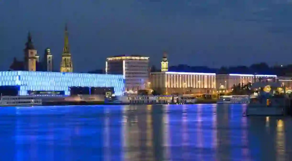 The Lentos Art Museum and the towers of the Parish Church, Old Cathedral, New Cathedral and Landhaus (Statehouse) on the Danube