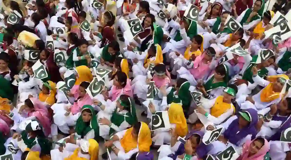 School children in Pakistan are dressed in the colours of the national flag