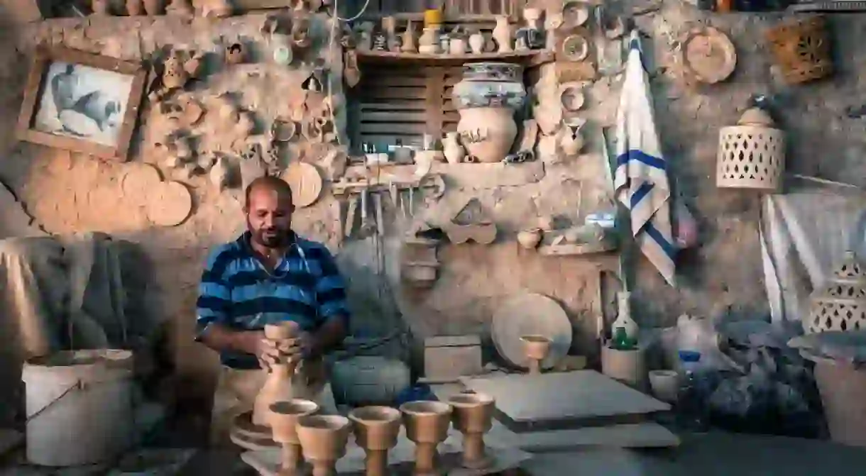 A craftsman at work in Aali village, Bahrain, known for its pottery