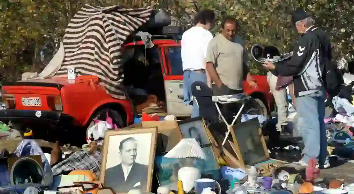 People trade at open flea market in Belgrade, Serbia.