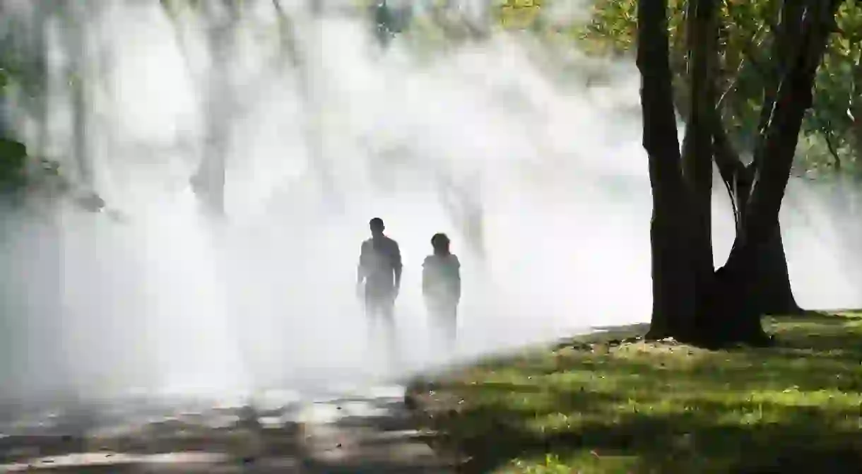 Fujiko Nakaya walking through her fog sculpture at the The Fens