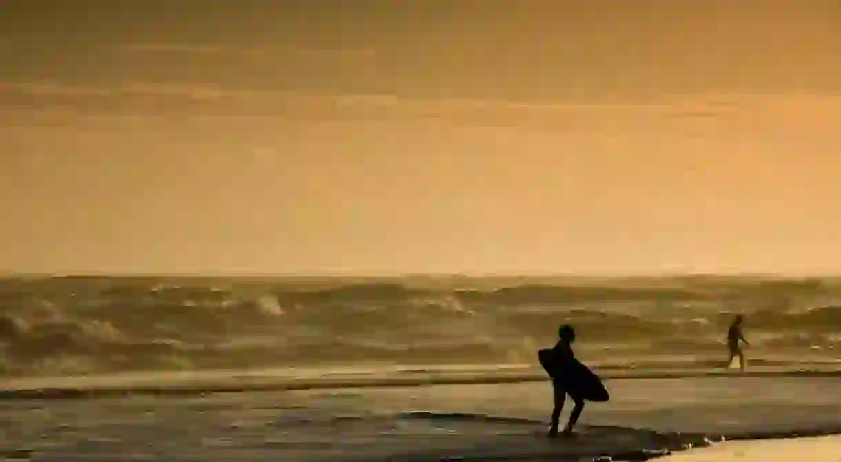 A lone surfer at Les Landes, France