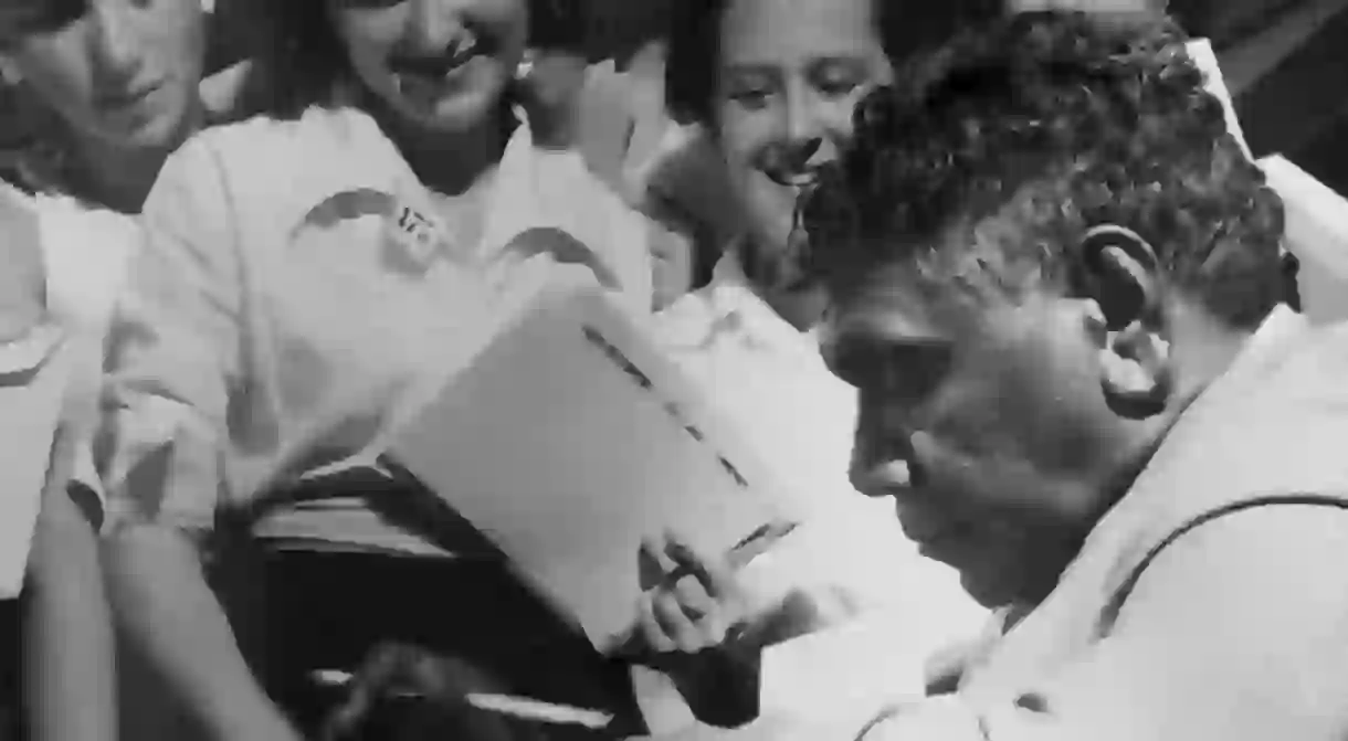 Albert Namatjira signing autographs in the late 1940s