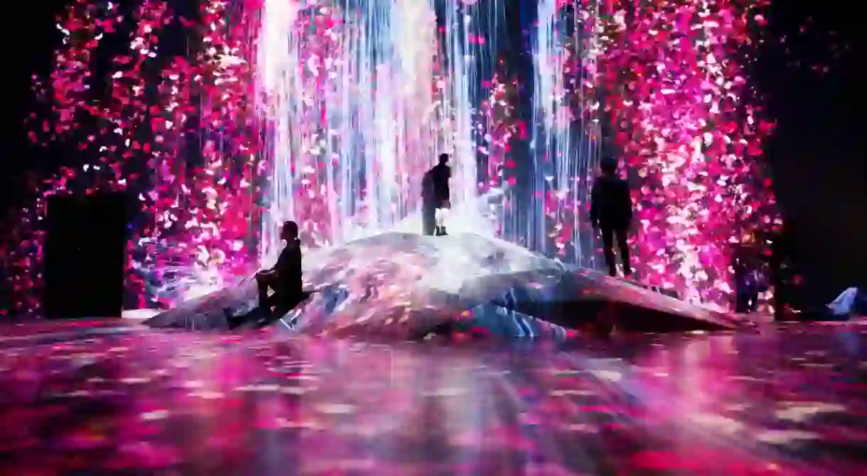 Universe of Water Particles on a Rock where People Gather