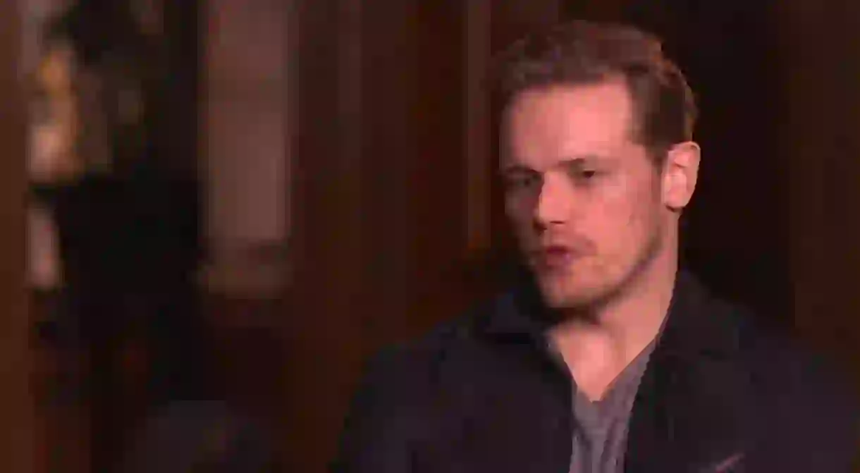 Sam Heughan speaking to Culture Trip