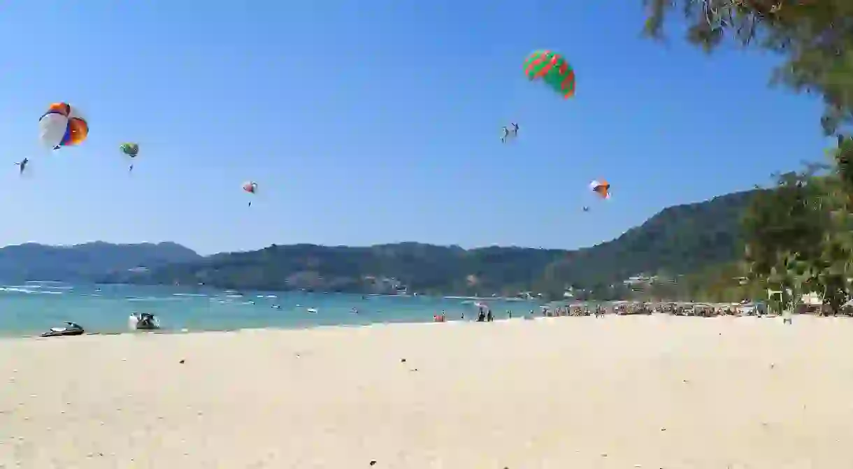 Patong Beach with parasailing, Phuket, Thailand.