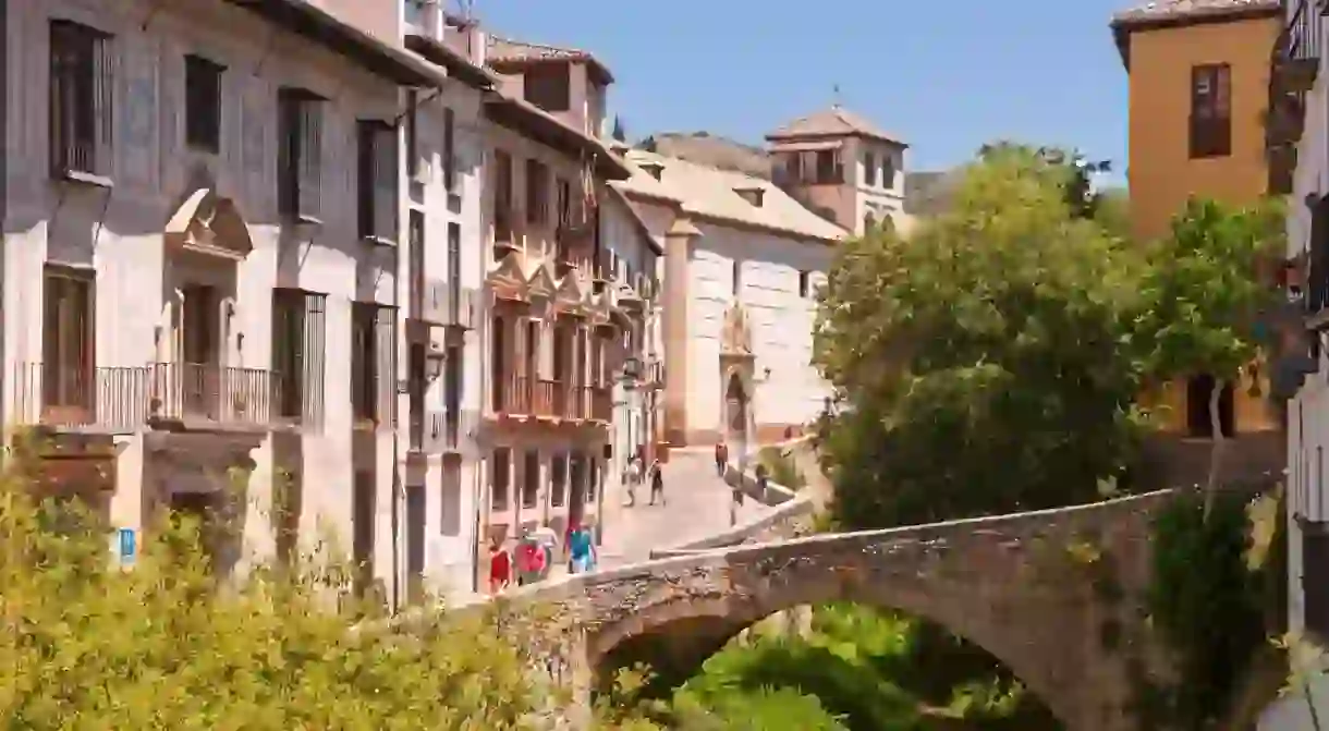 Granada is packed architectural heritage, such as this bridge over the River Darro in Granada