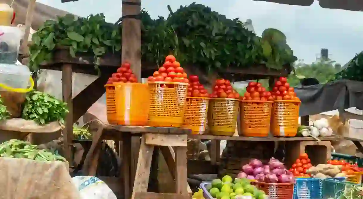 Local grocery market with fruits vegetables in Nigeria.