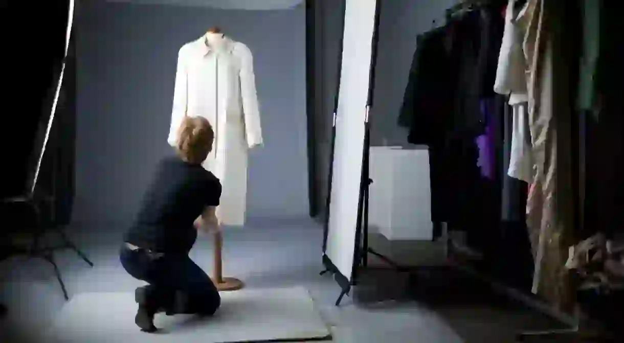 A stylist preps a garment to be photographed