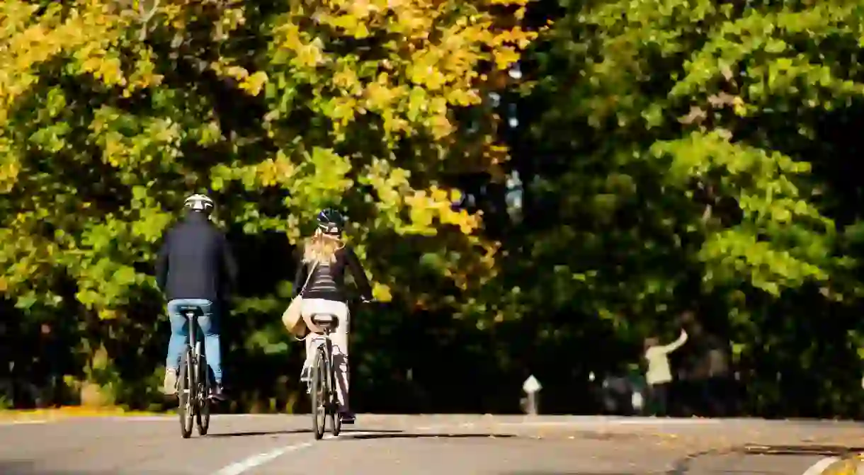 A couple ride bikes in Central Park, Manhattan