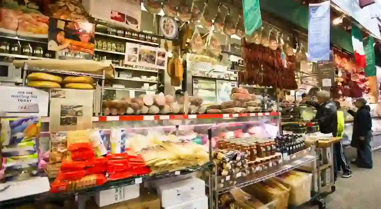 Shoppers place orders at an Italian deli in Little Italy in the Bronx