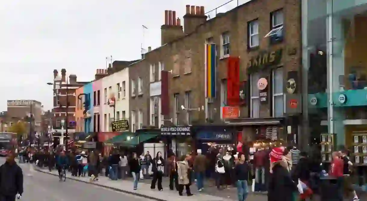 Crowds of people walk through Camden Lock, London