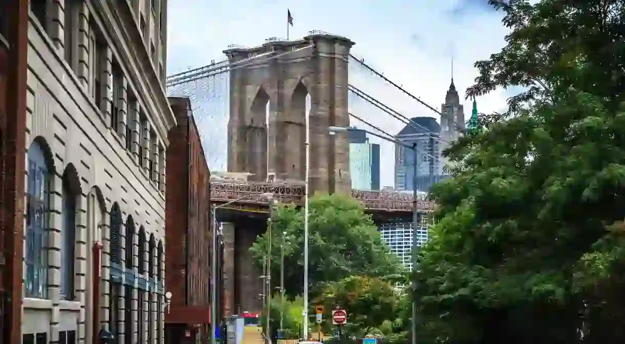 Manhattan Bridge looms over the historic neighborhood of Dumbo, in Brooklyn