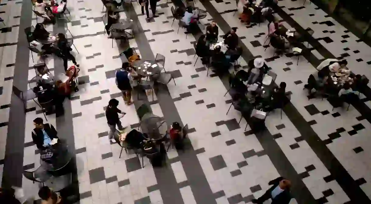 Tourists at a bar in shopping mall, Roppongi Hills